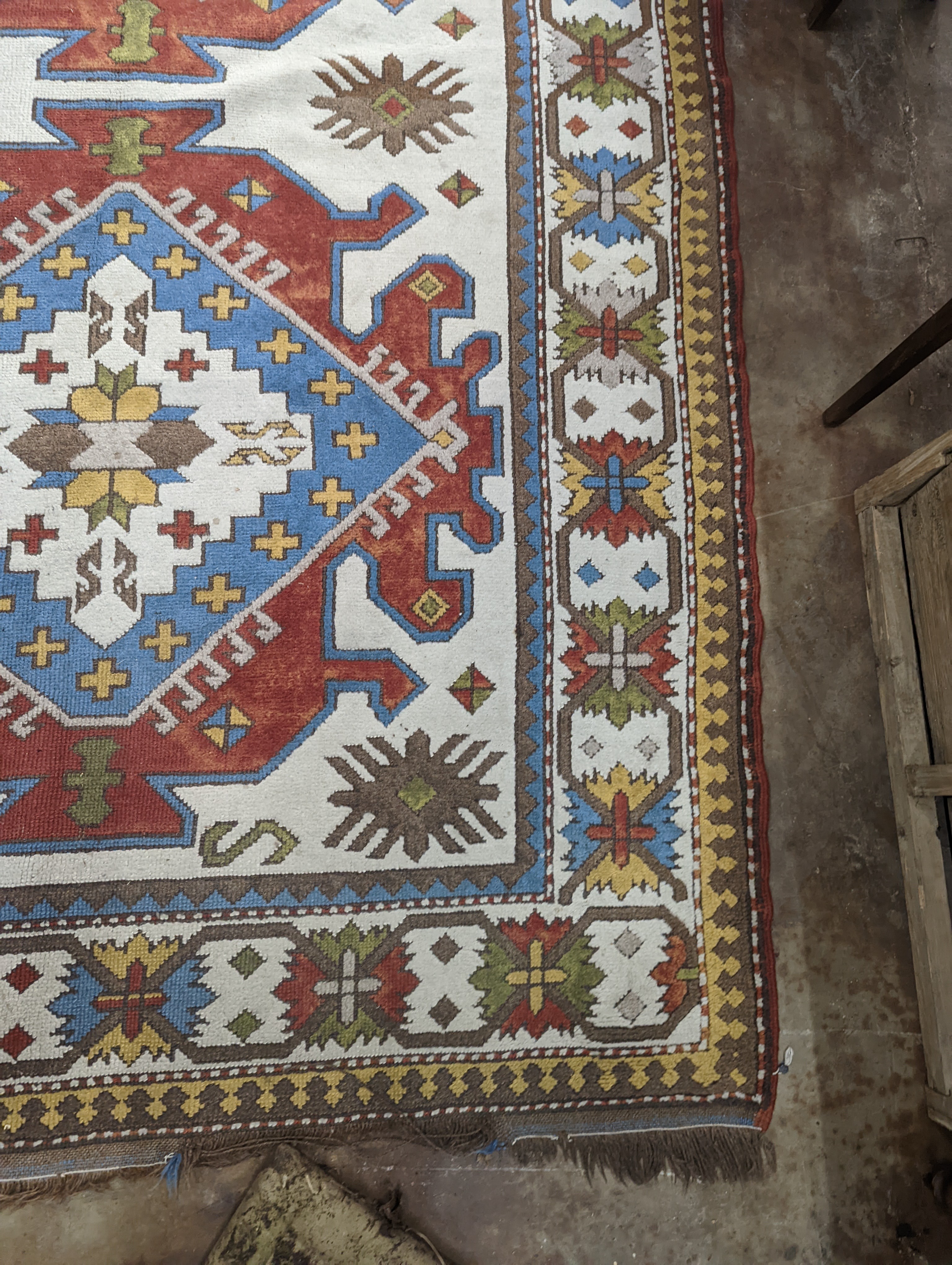 A Caucasian design ivory ground carpet, 270 x 170cm